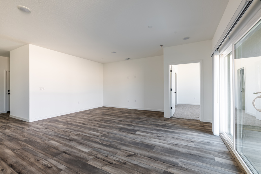 A room with a wood floor and a wood floor.