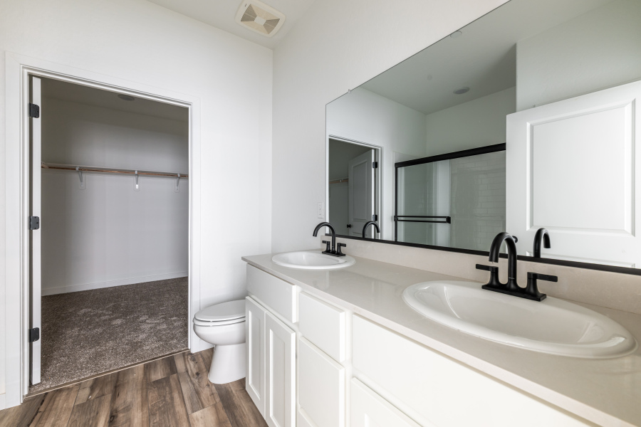 A bathroom with a sink and a toilet.