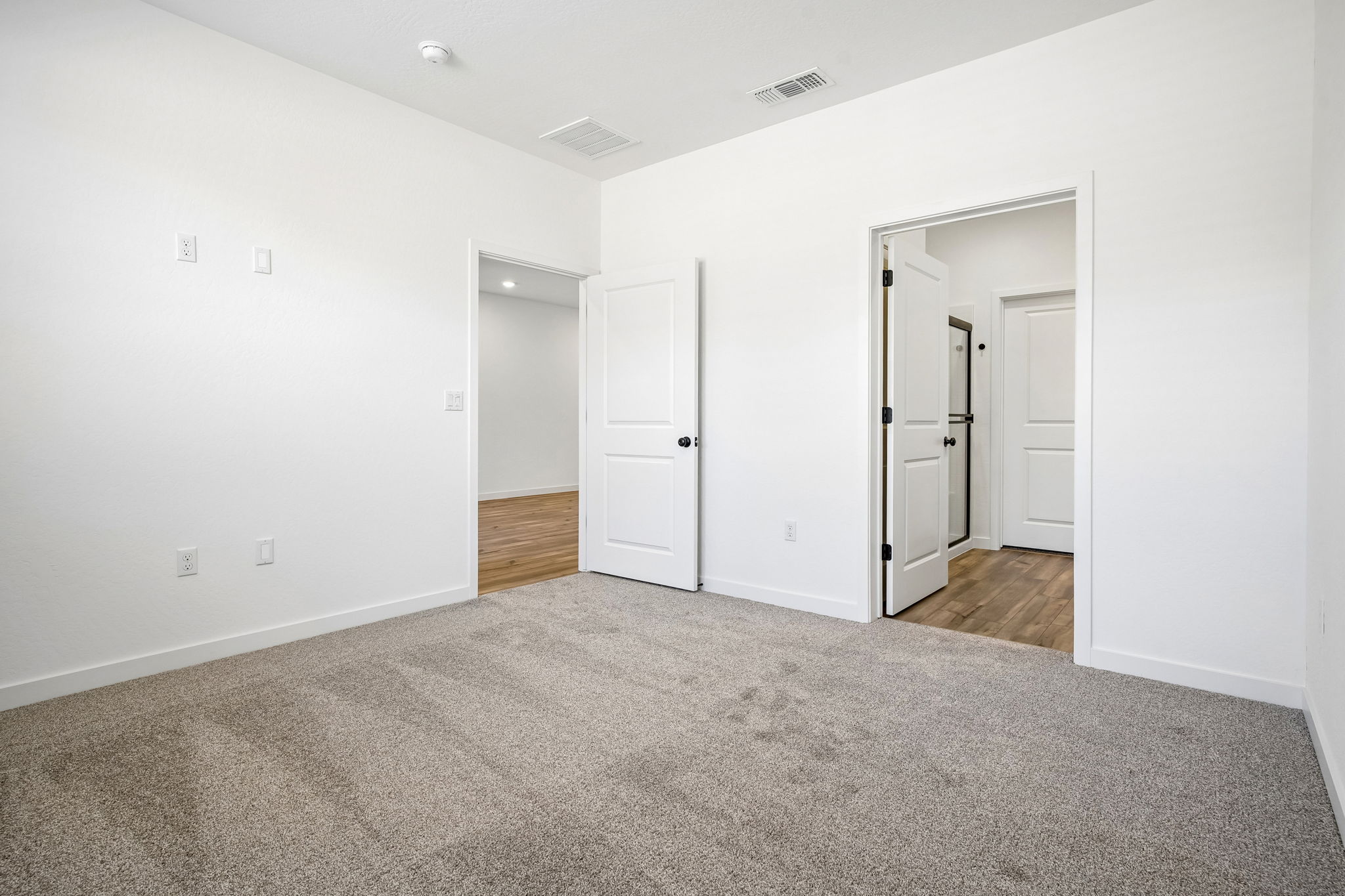 A room with white doors.