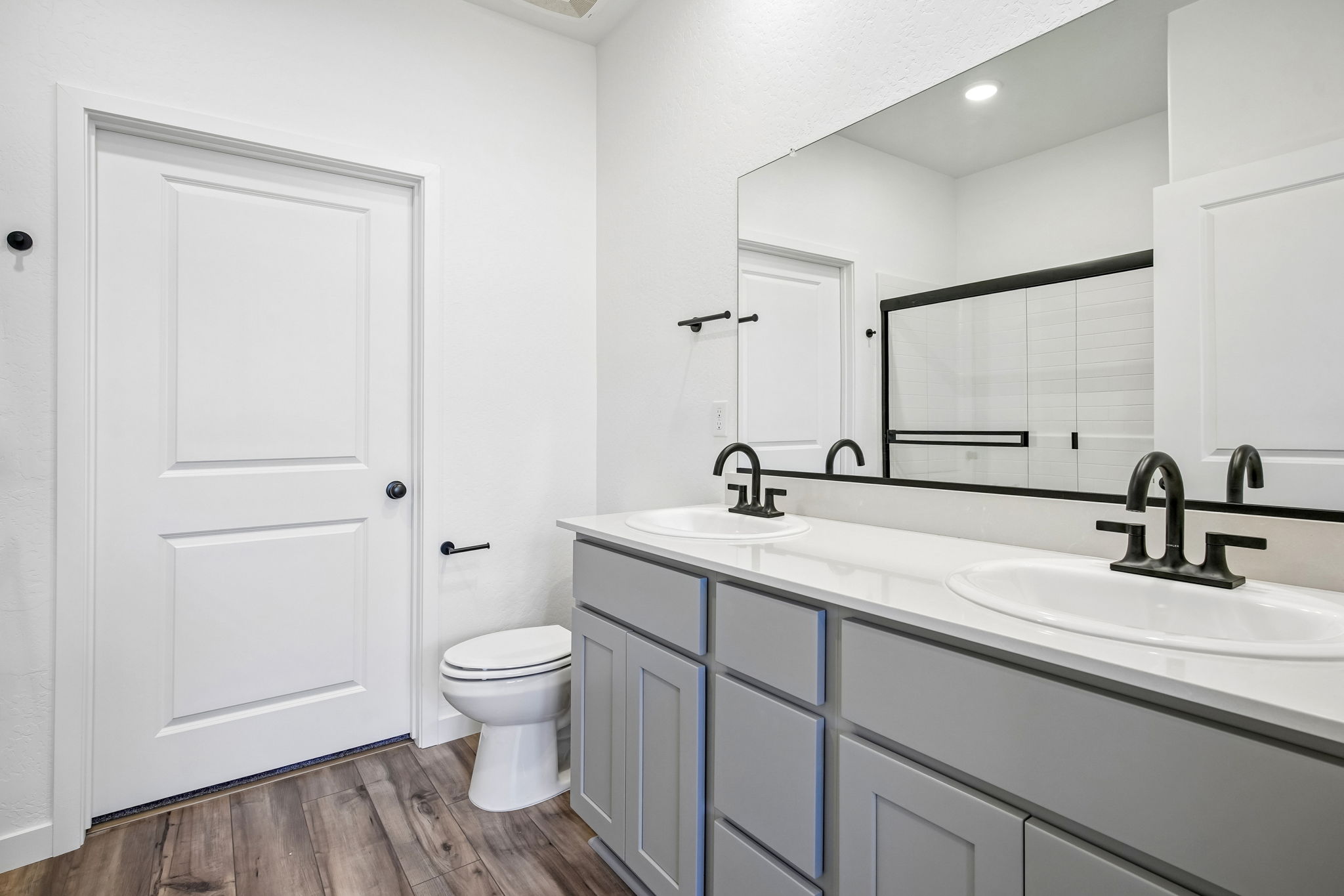 A bathroom with a toilet and sink.