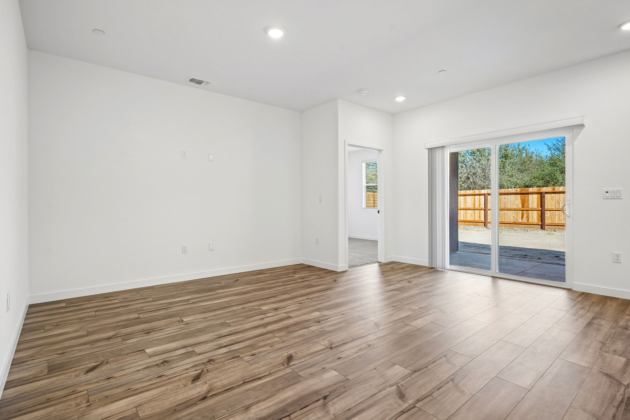 A room with a wood floor and a wood floor.