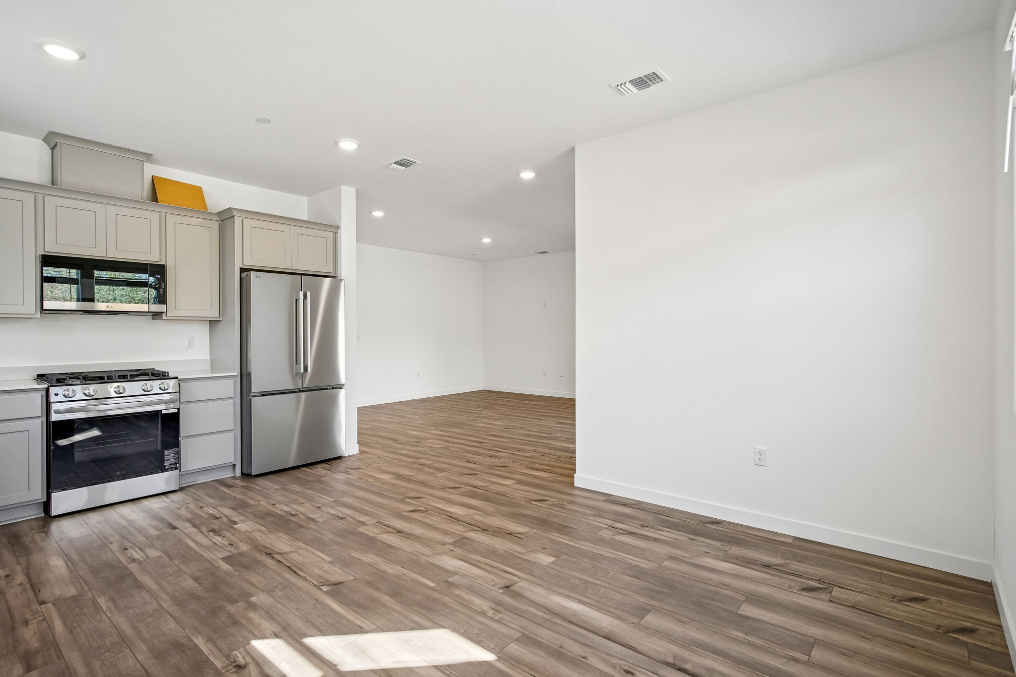 A kitchen with wooden floors.