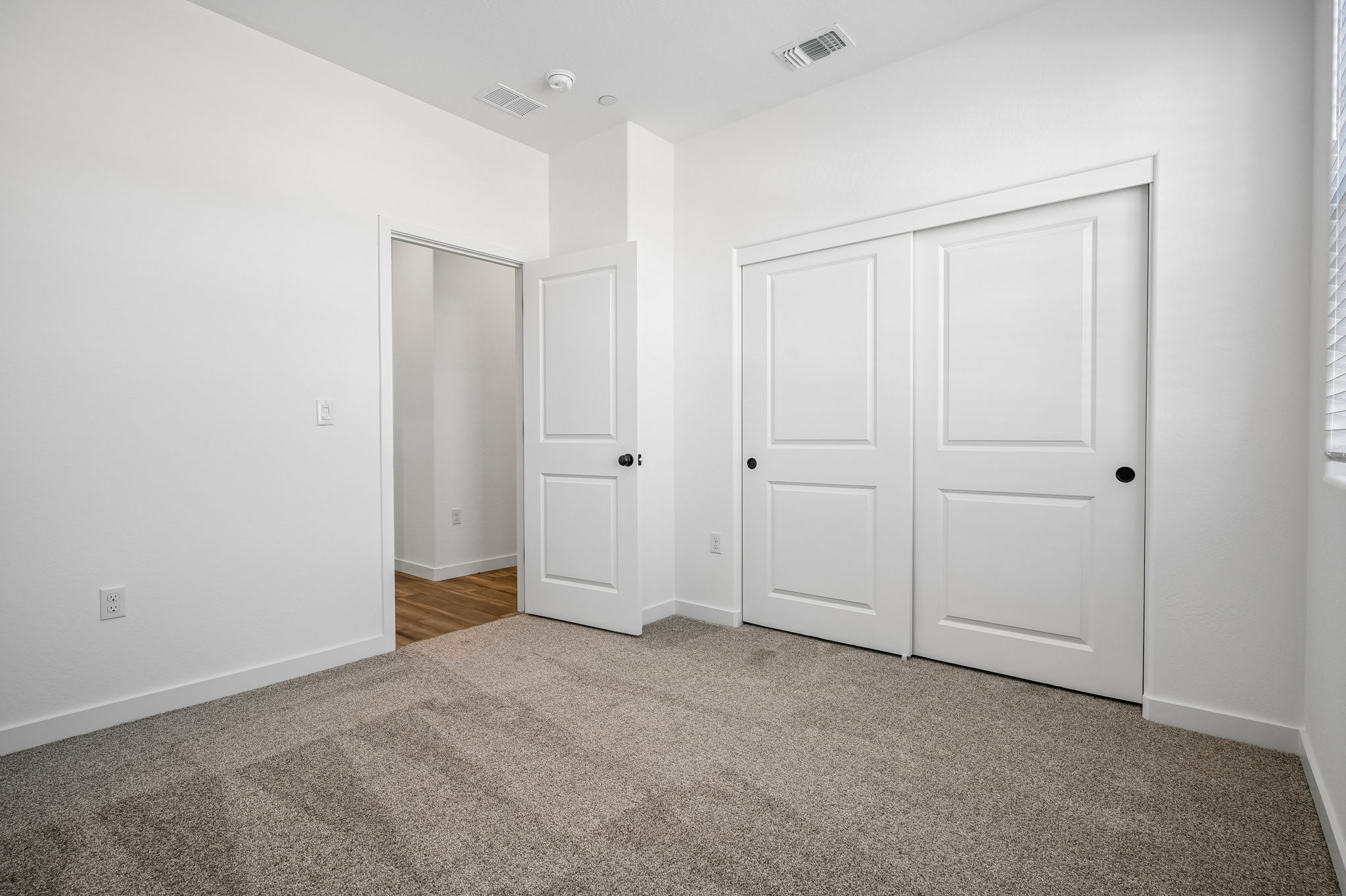 A room with white doors.