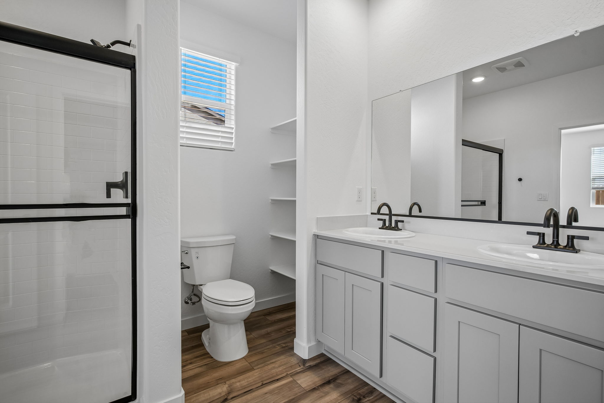 A bathroom with a toilet and sink.