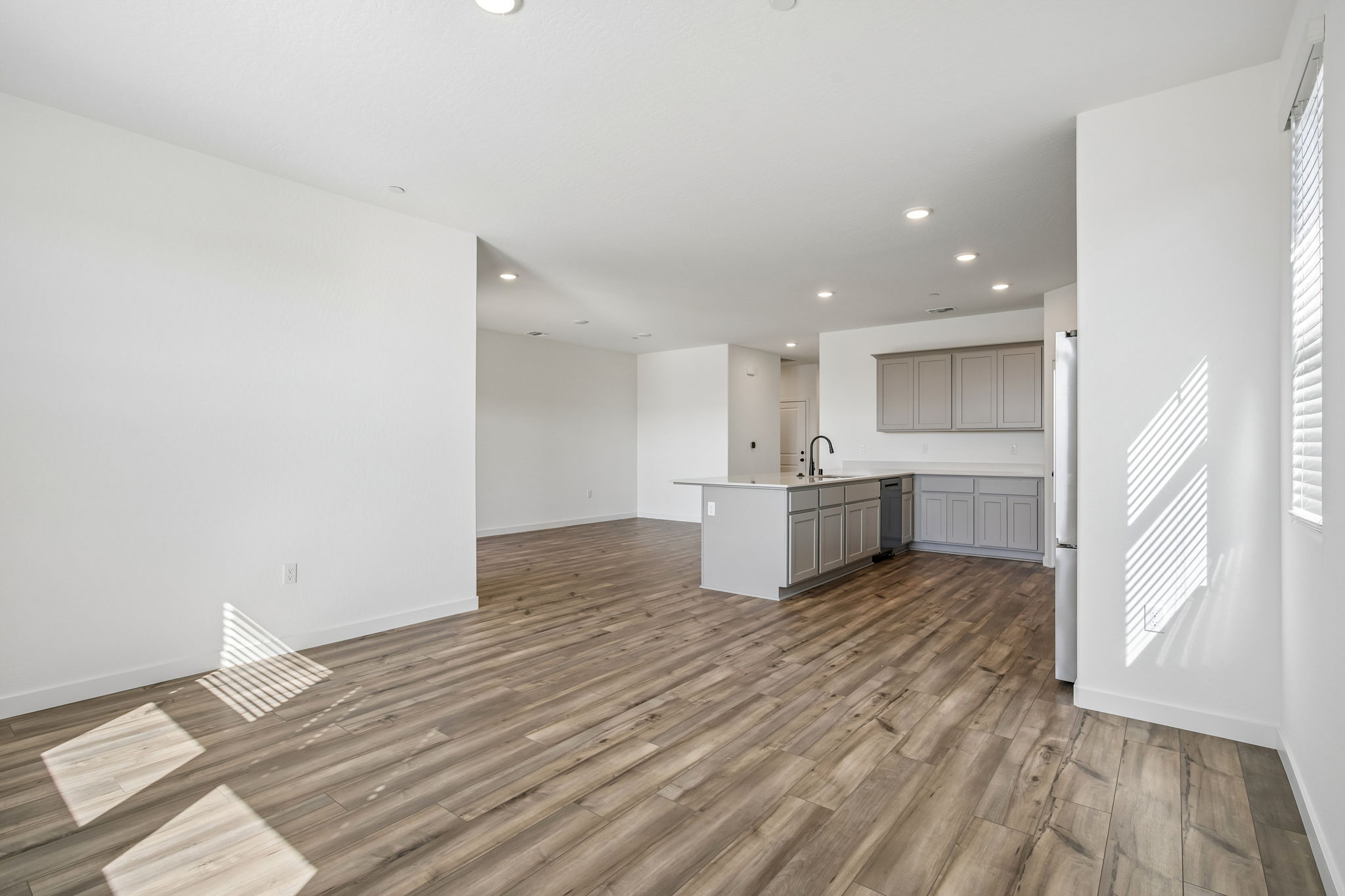 A kitchen with white walls.