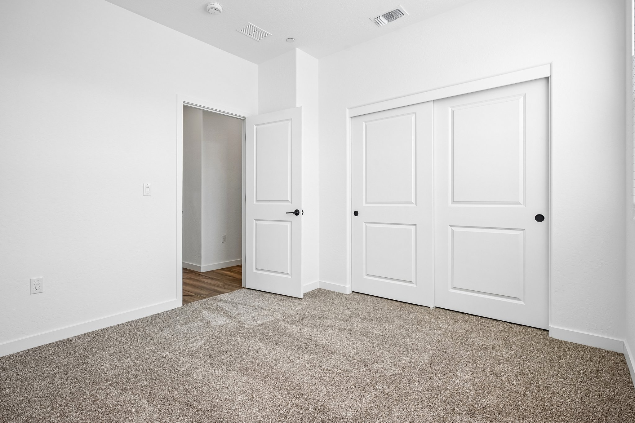 A room with white doors.
