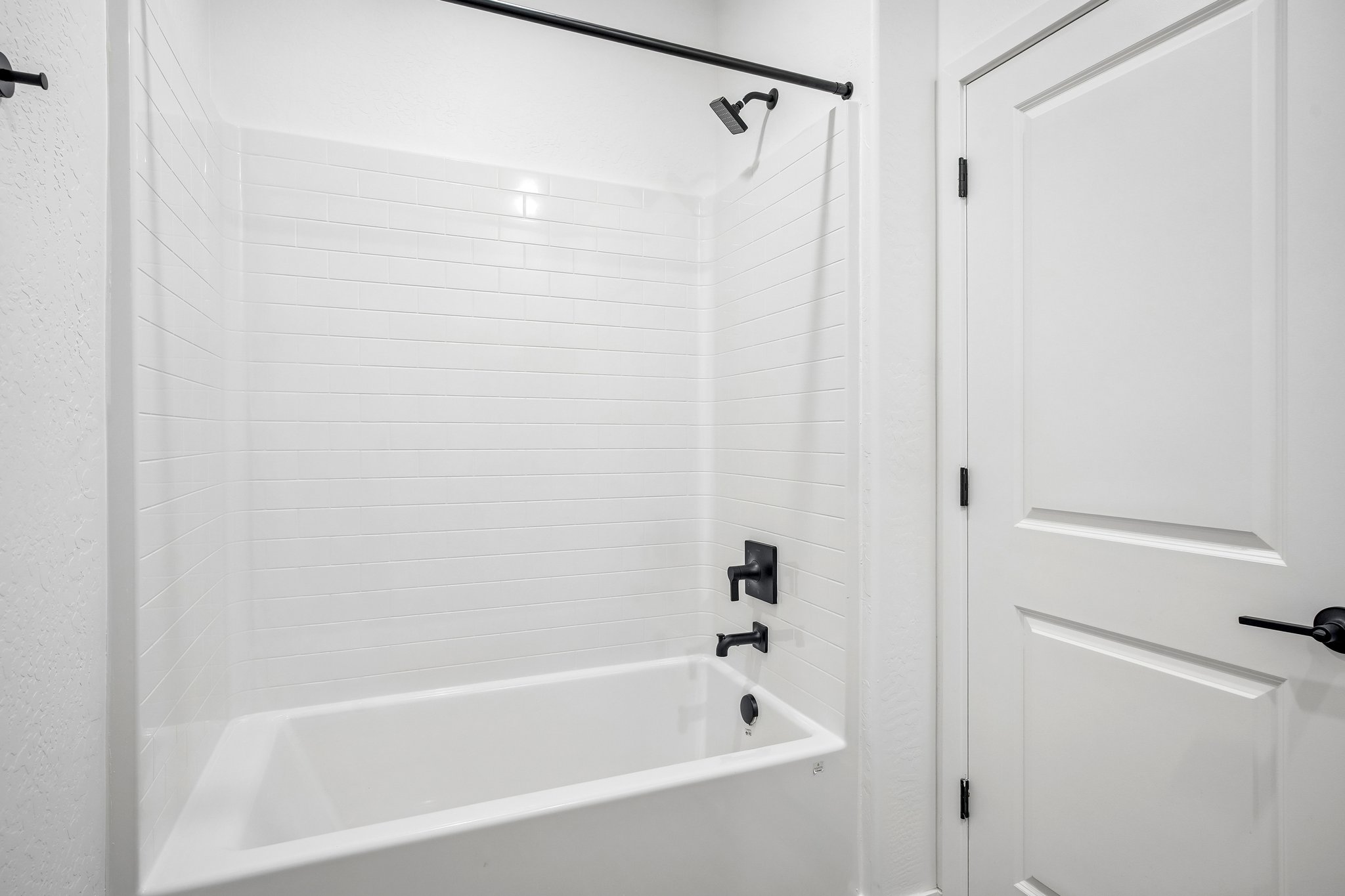 A bathtub in a bathroom.