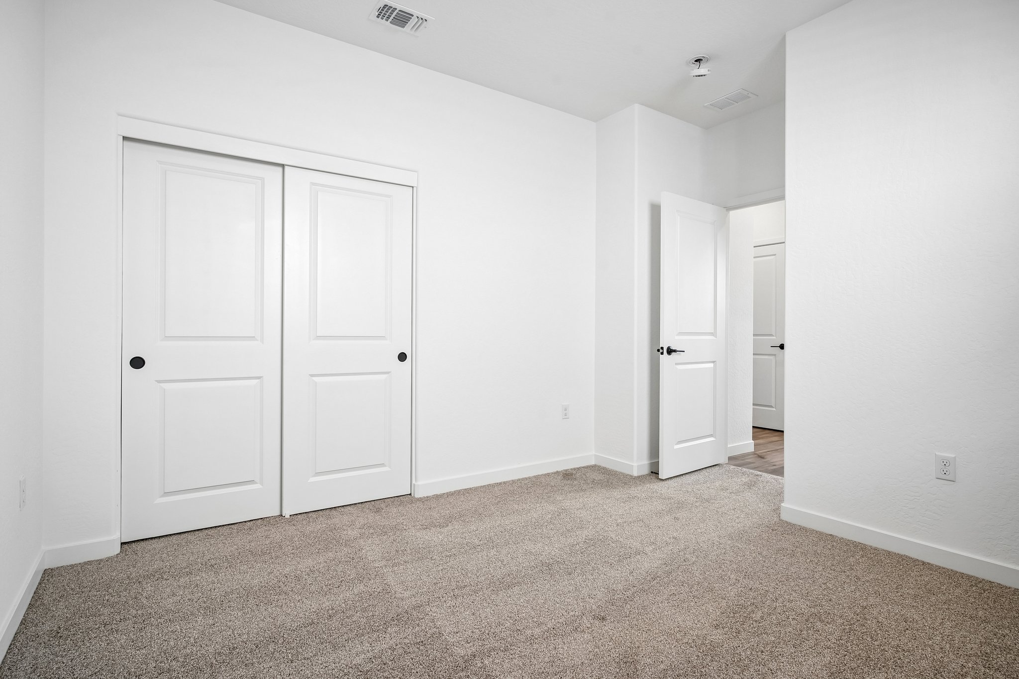 A room with white doors.