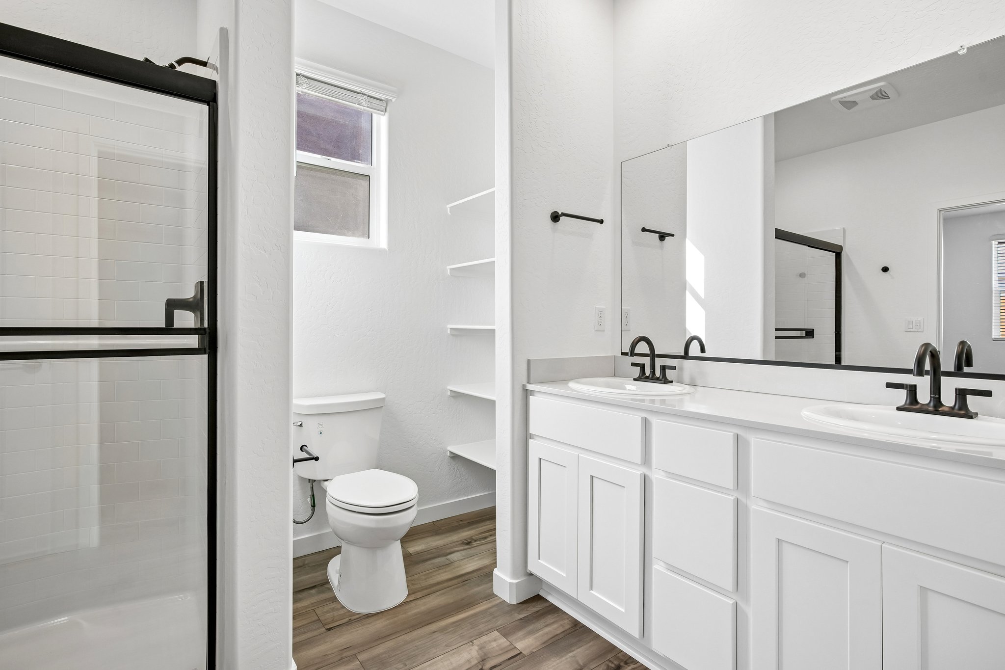 A bathroom with a toilet and sink.