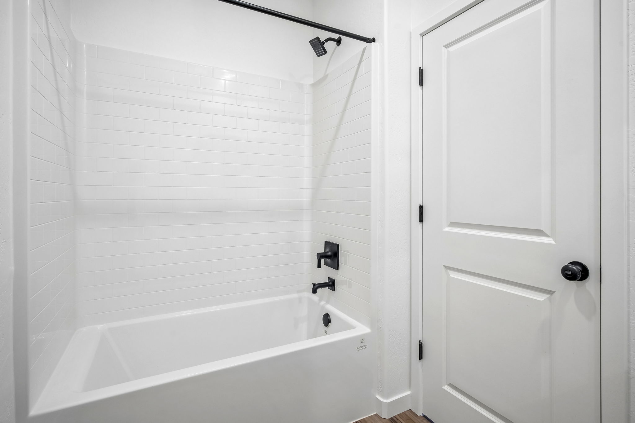 A bathtub in a bathroom.