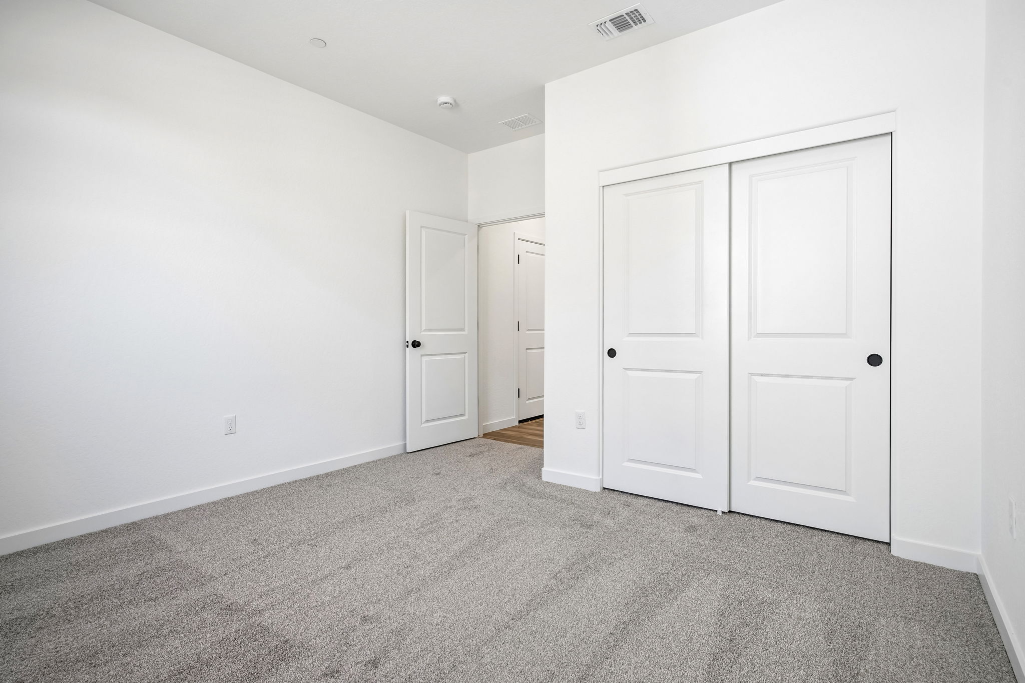 A room with white doors.