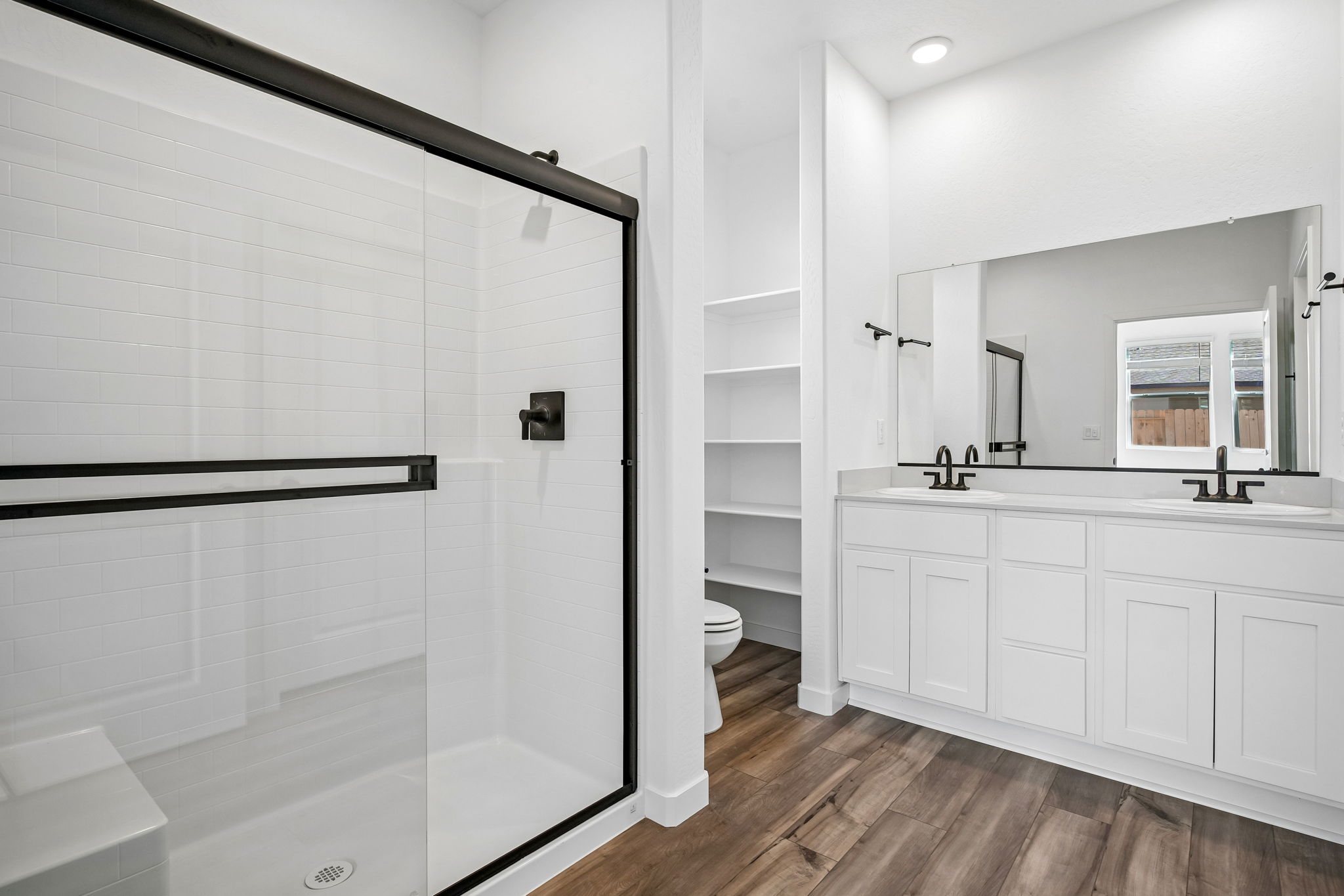A bathroom with a glass shower.