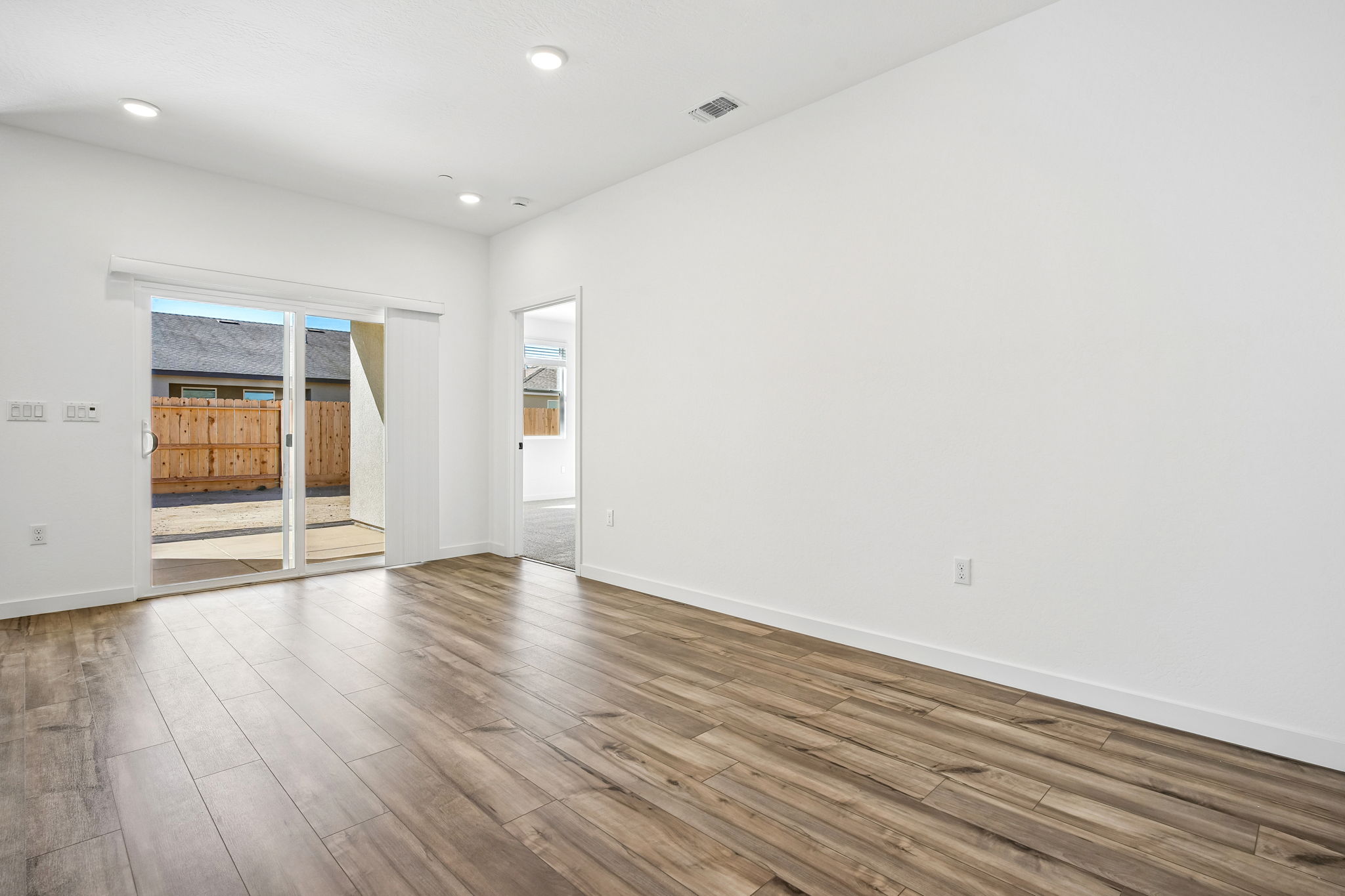 A room with a wood floor and a wood floor.