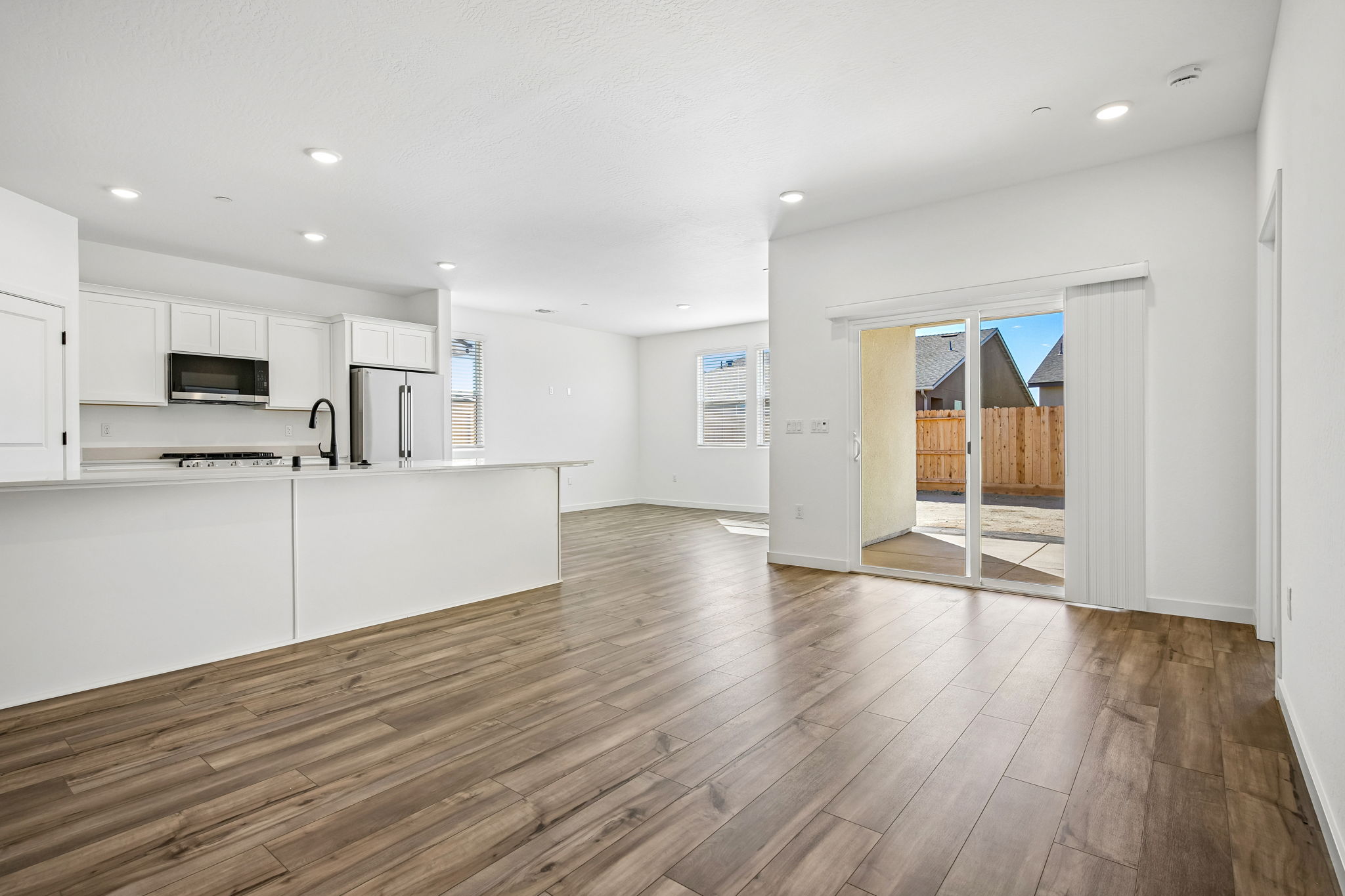 A large kitchen with white cabinets.