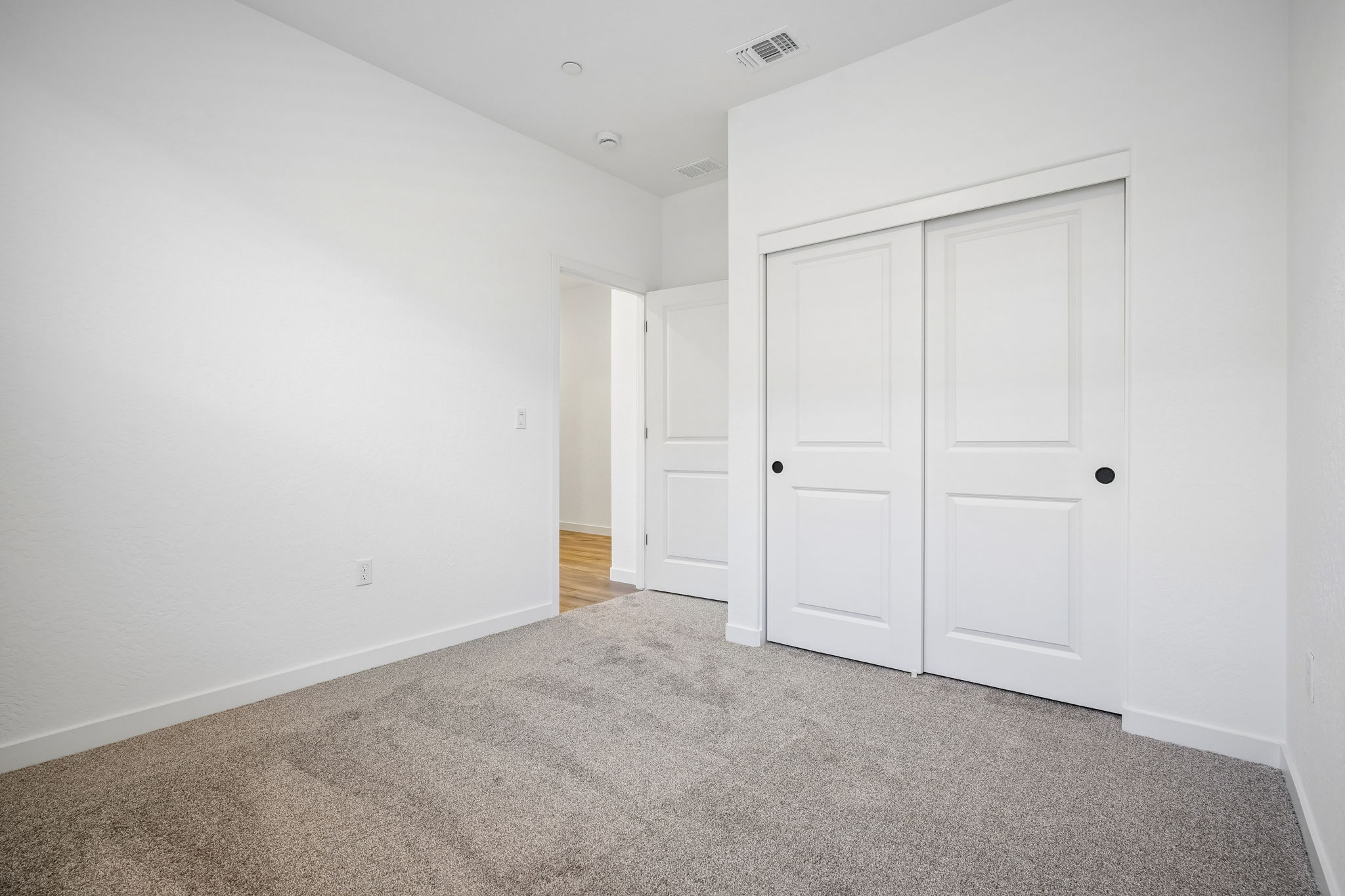 A room with white doors.