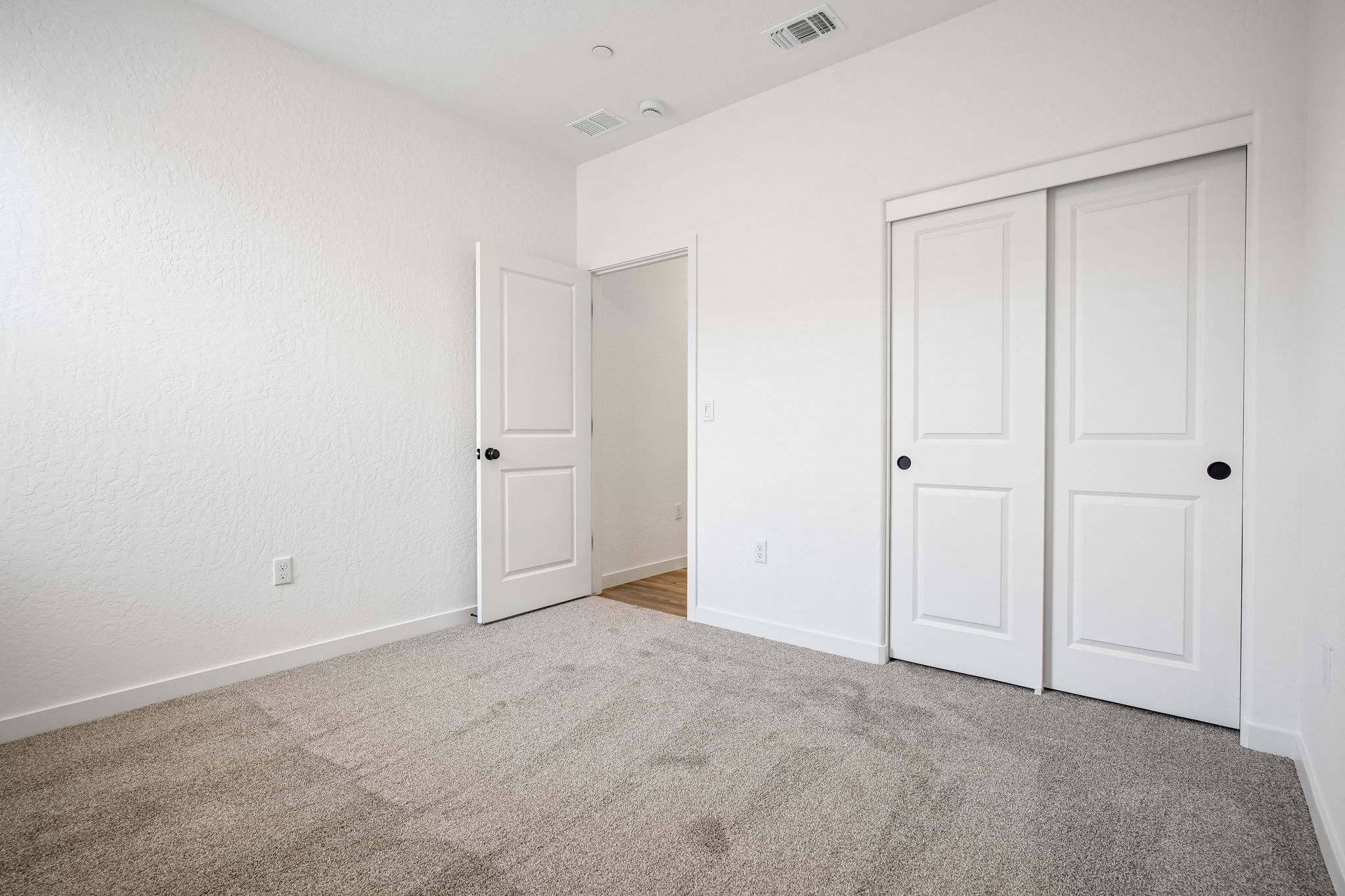 A room with white doors.