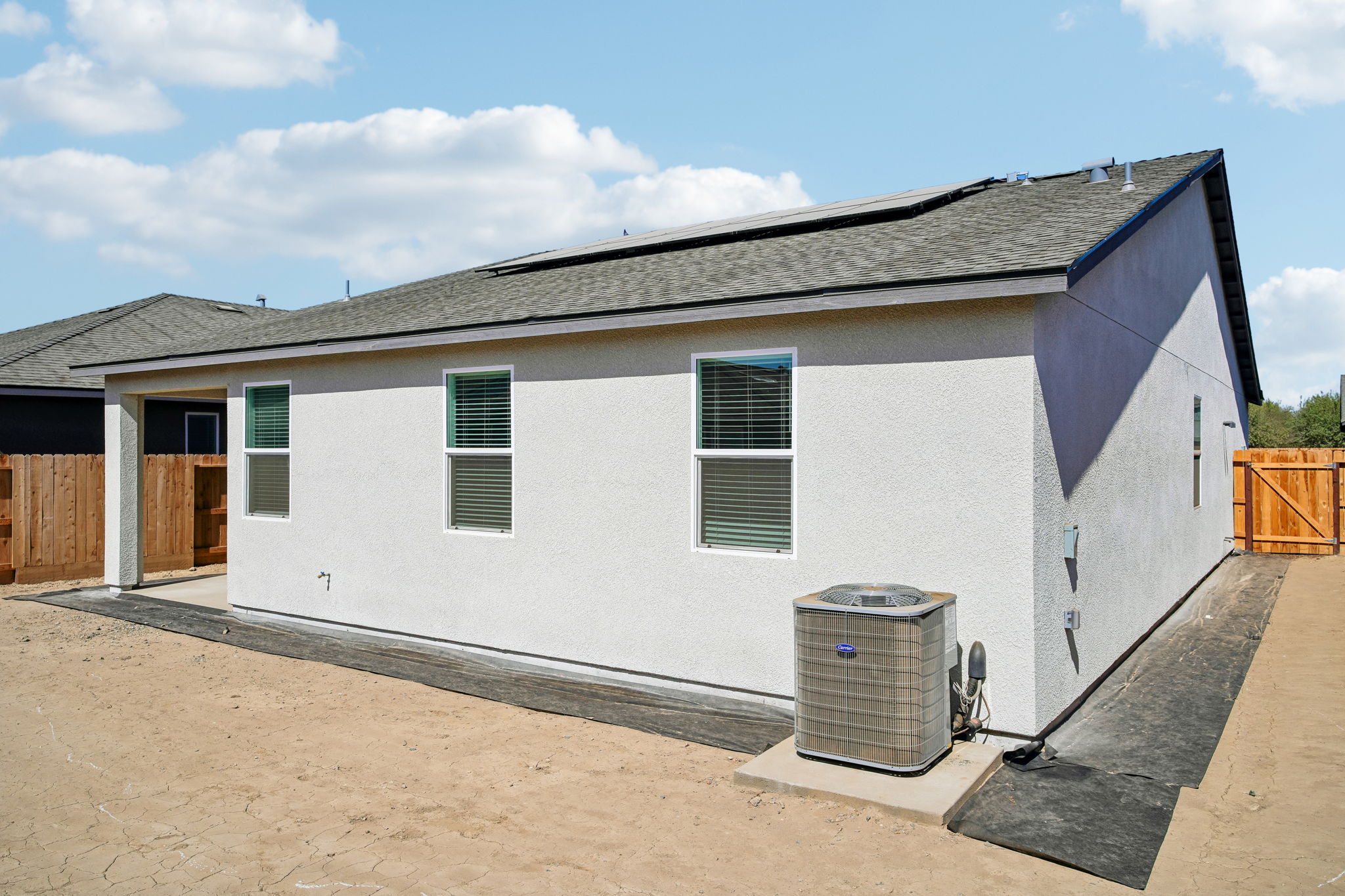 A white house with a blue roof.