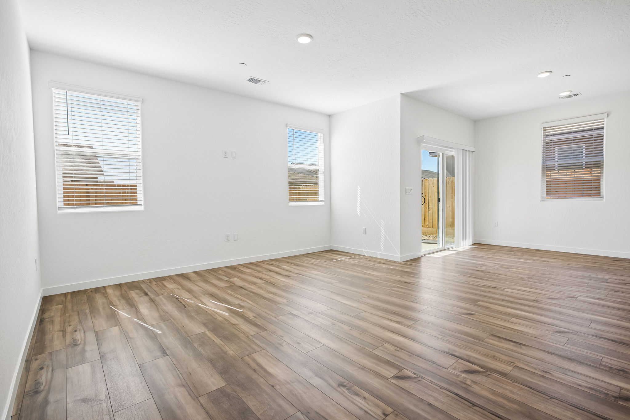 A room with a wood floor and a wood floor.