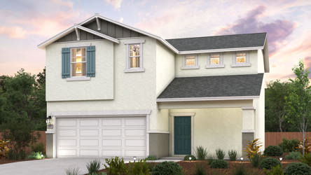 A white house with a garage.