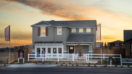 A house with a white picket fence.