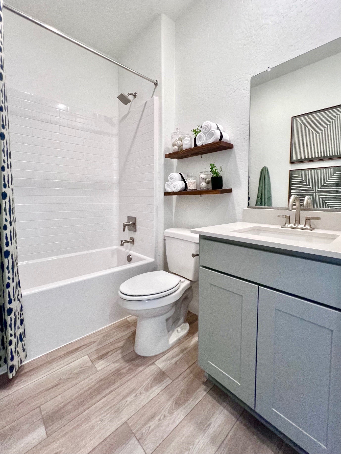 A bathroom with a tub toilet and sink.