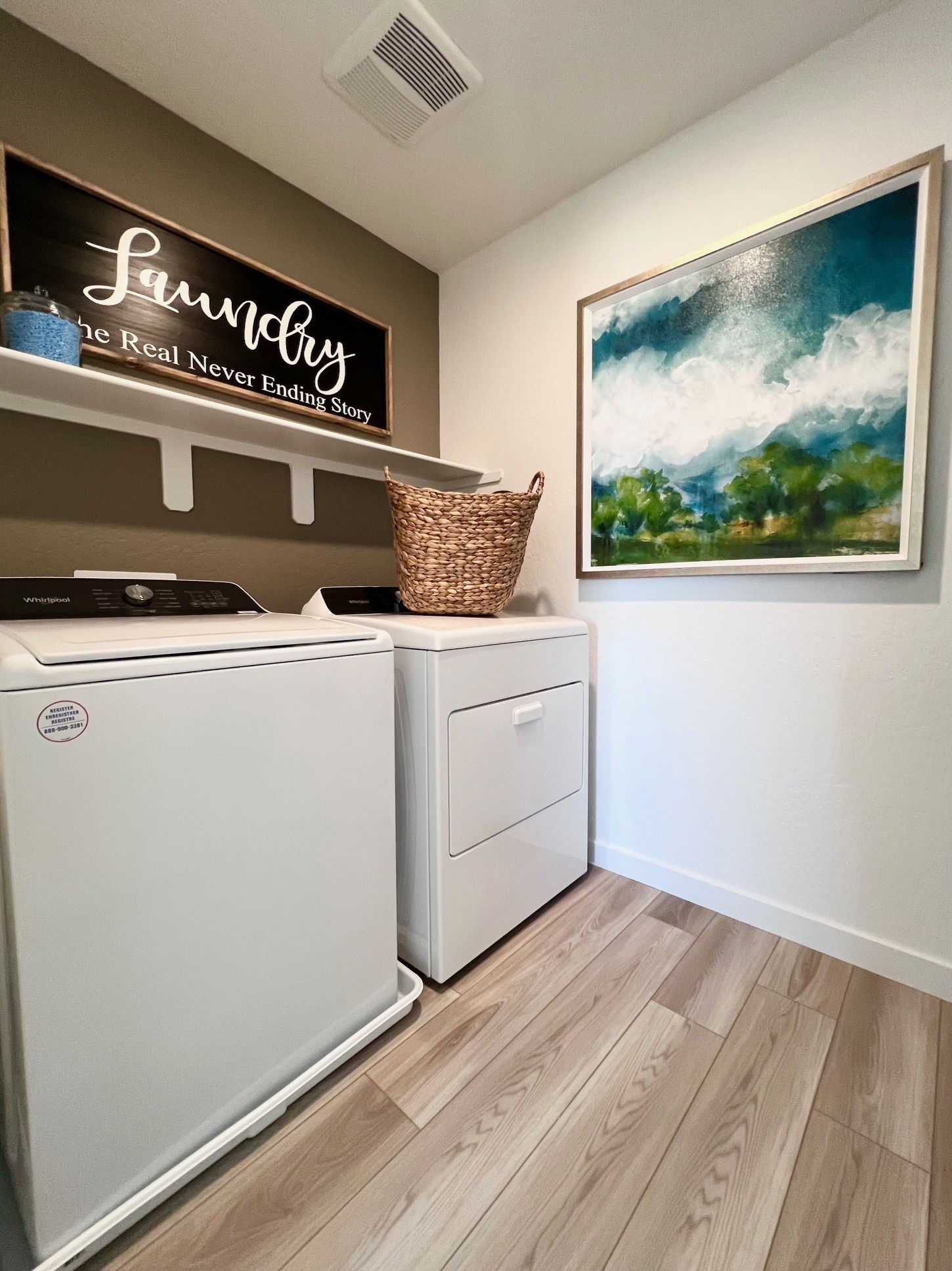 A kitchen with a white refrigerator.