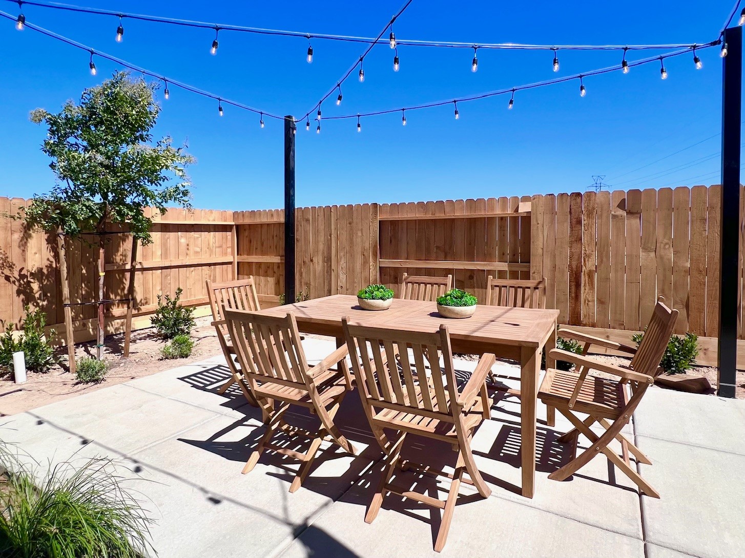A table and chairs on a patio.