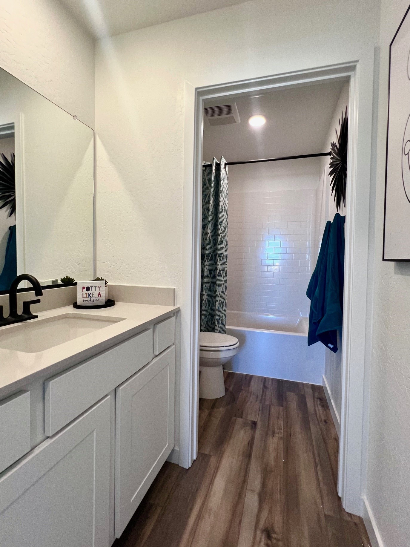 A bathroom with a sink and a toilet.