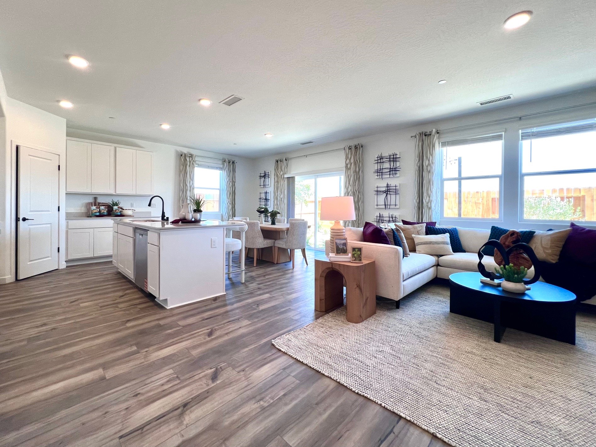 A living room with a wood floor.