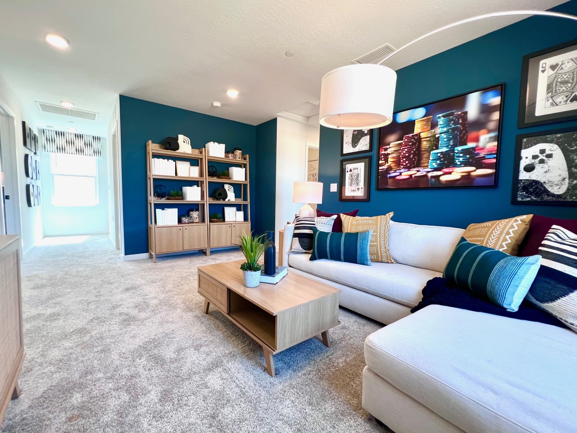 A living room with a blue wall.