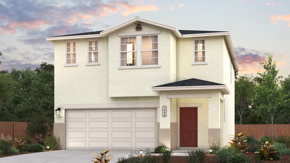 A white house with a garage.