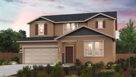 A house with a garage and a garden in front of it.