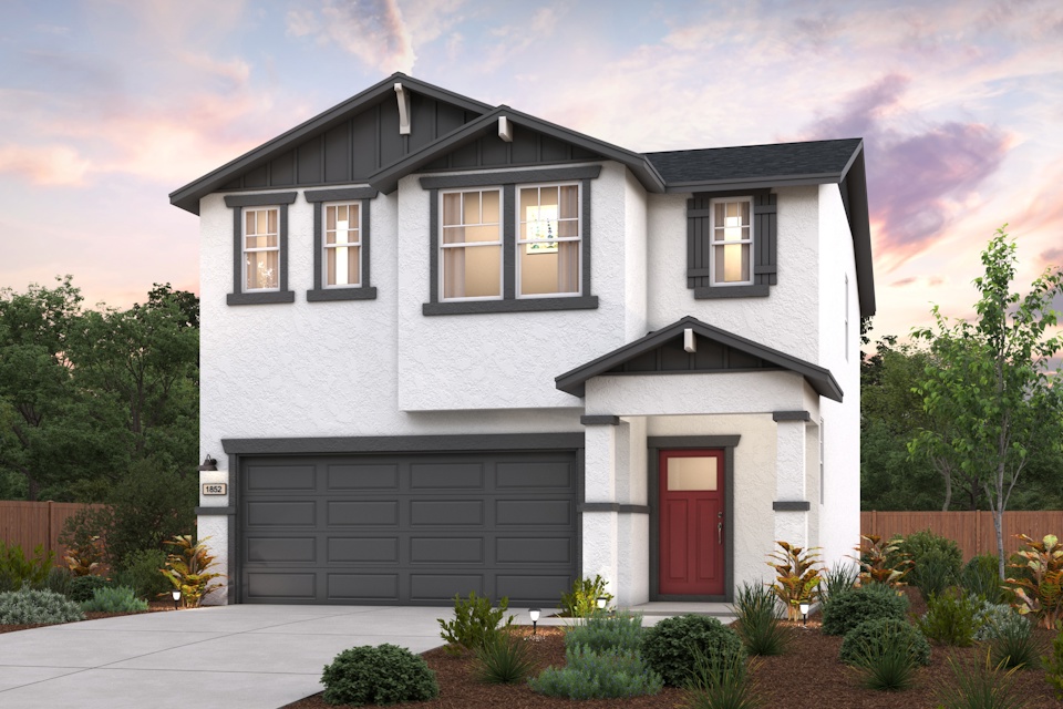 A white house with a garage.