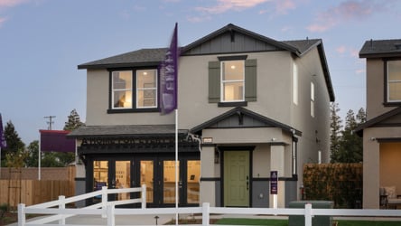 A house with a white picket fence.
