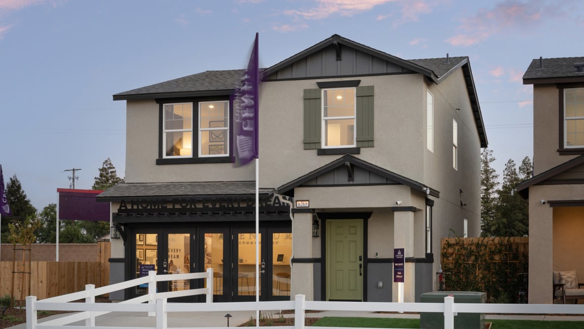 A house with a white picket fence.