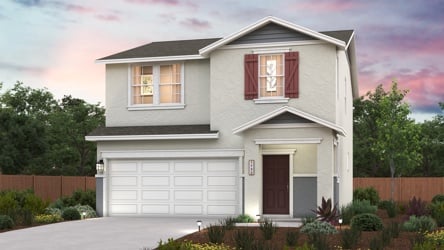 A house with a garage and a fence.