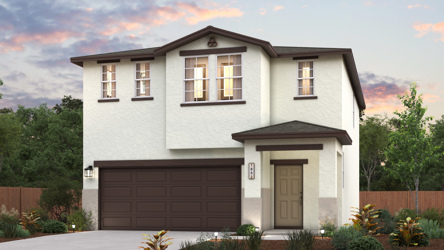 A house with a garage and trees.