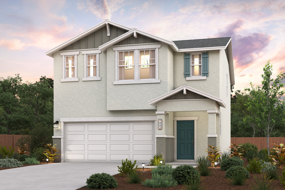 A white house with a garage.