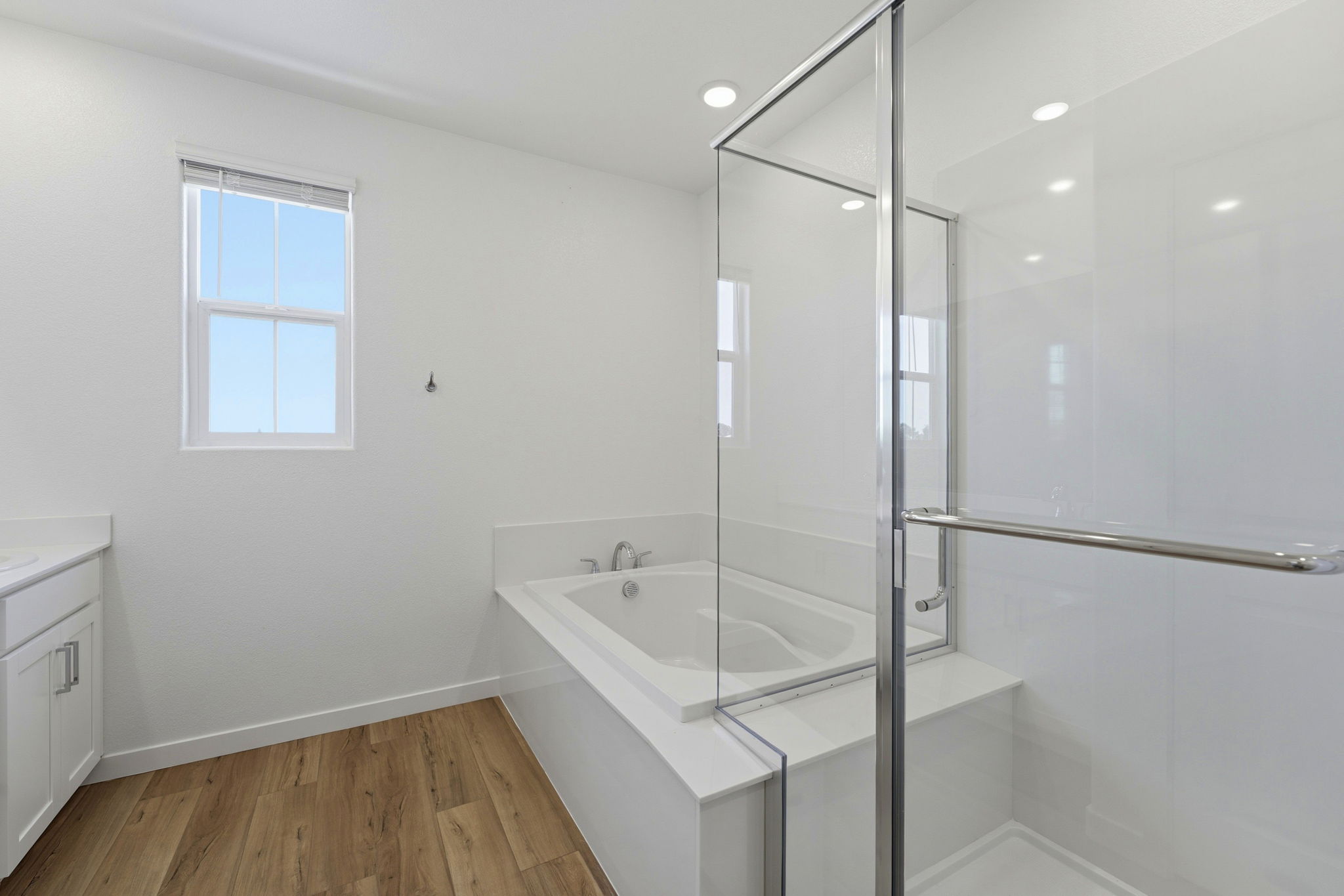 A bathroom with a glass shower.