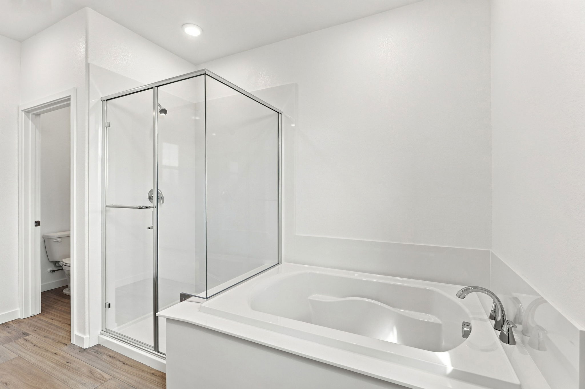 A bathroom with a glass shower.