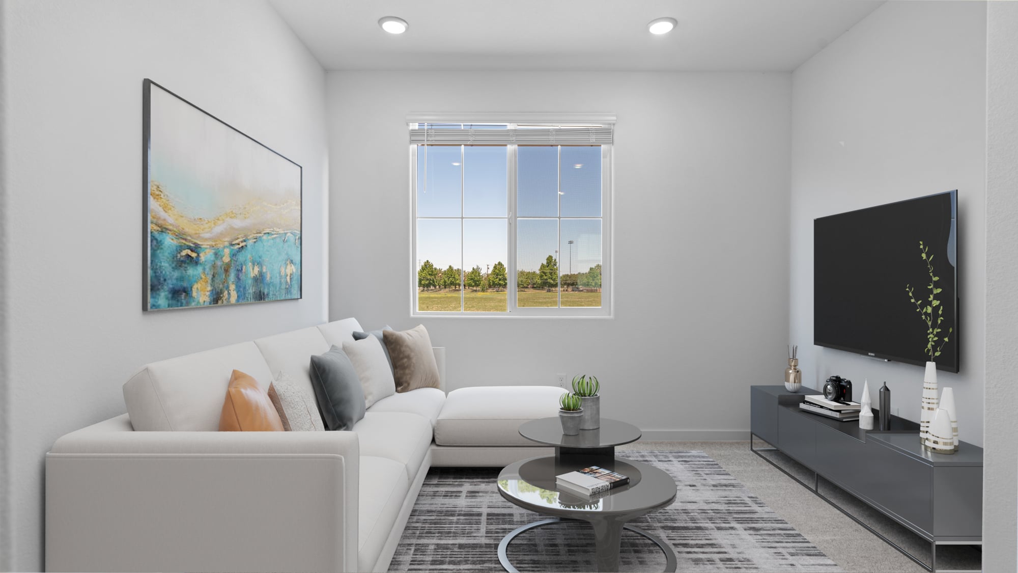 A living room with a white couch and a coffee table.