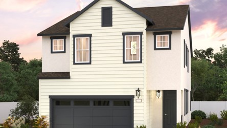 A white house with a garage.