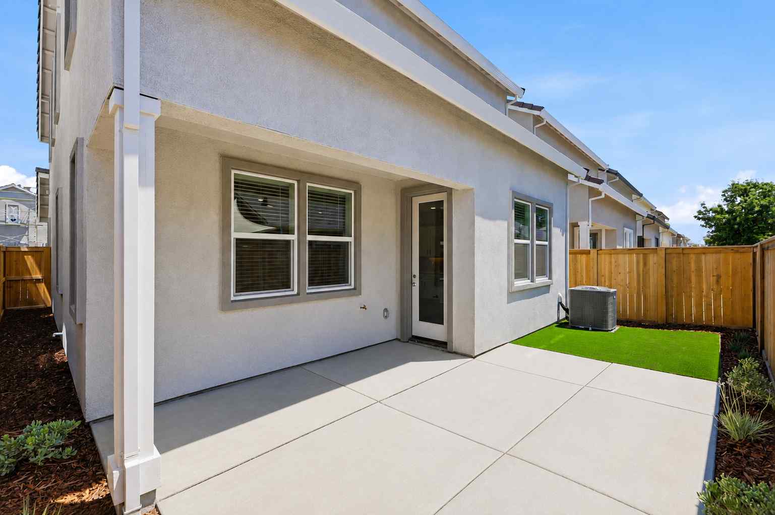 A house with a fence and a yard.