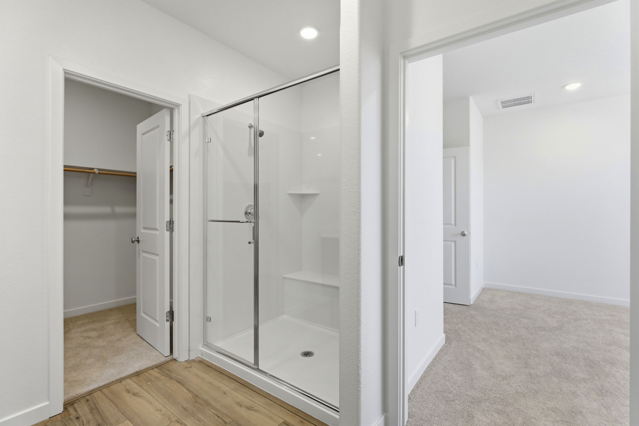 A bathroom with a glass shower.