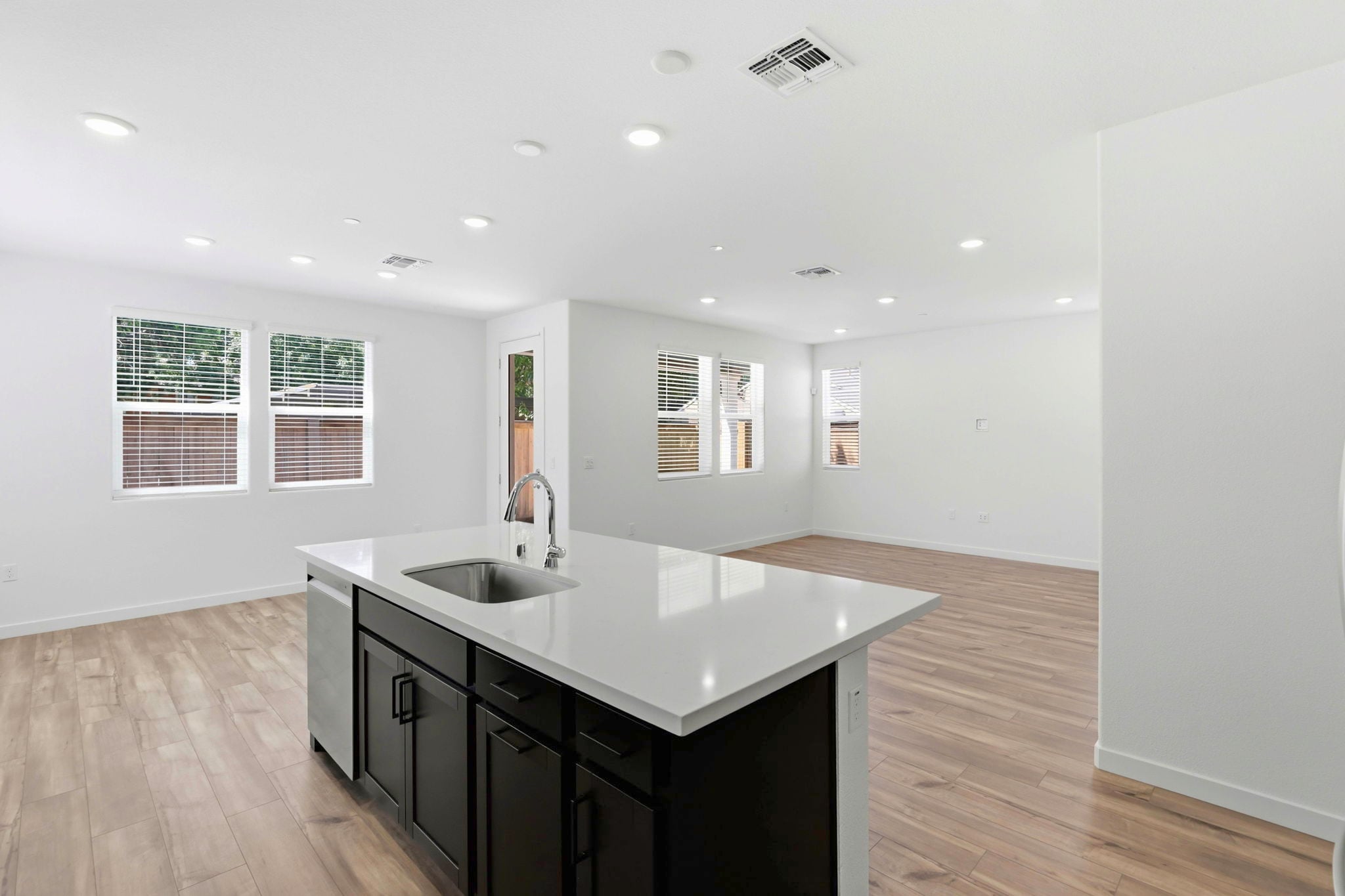 A large bathroom with a large marble countertop.