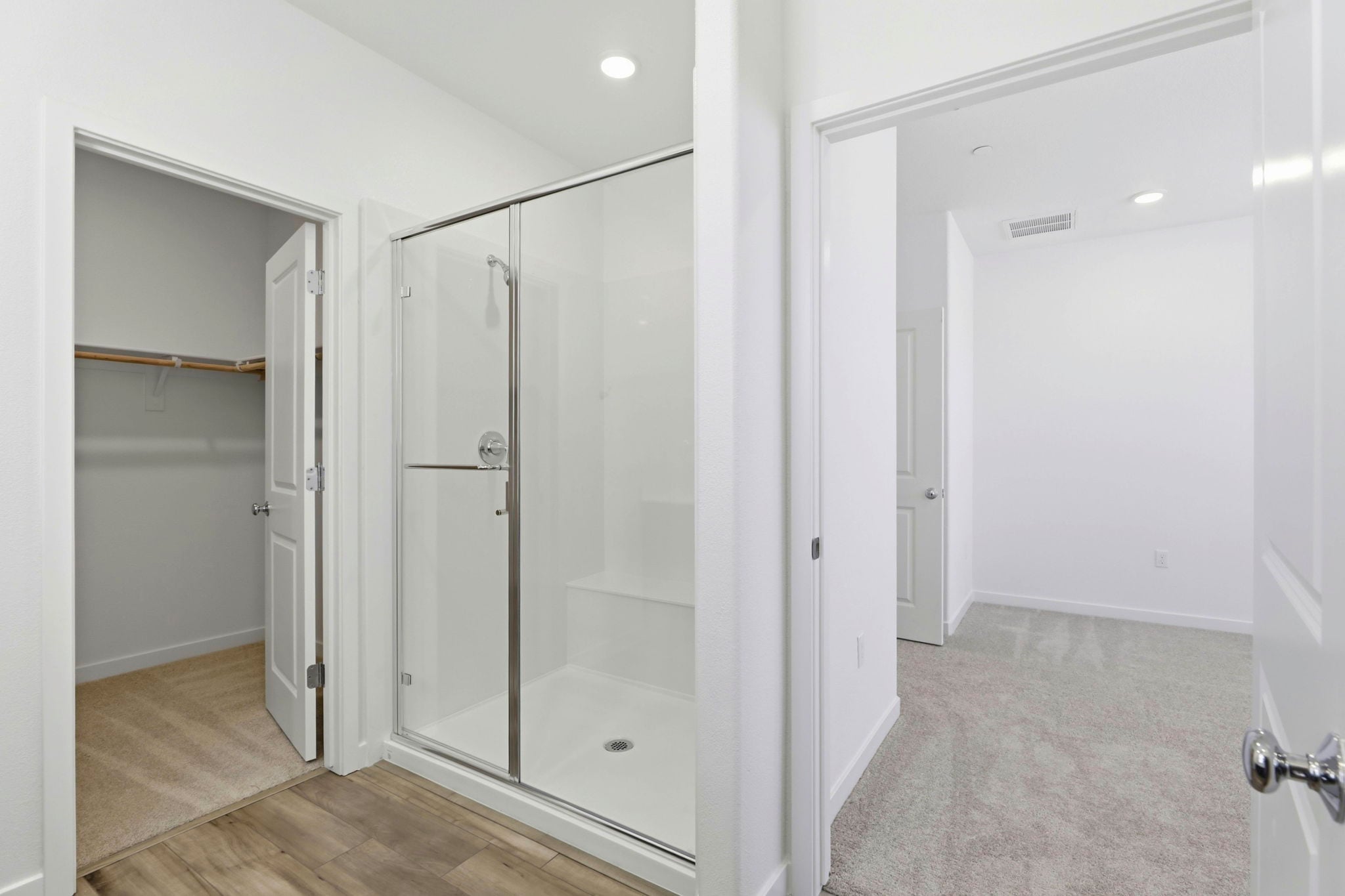 A bathroom with a glass shower.