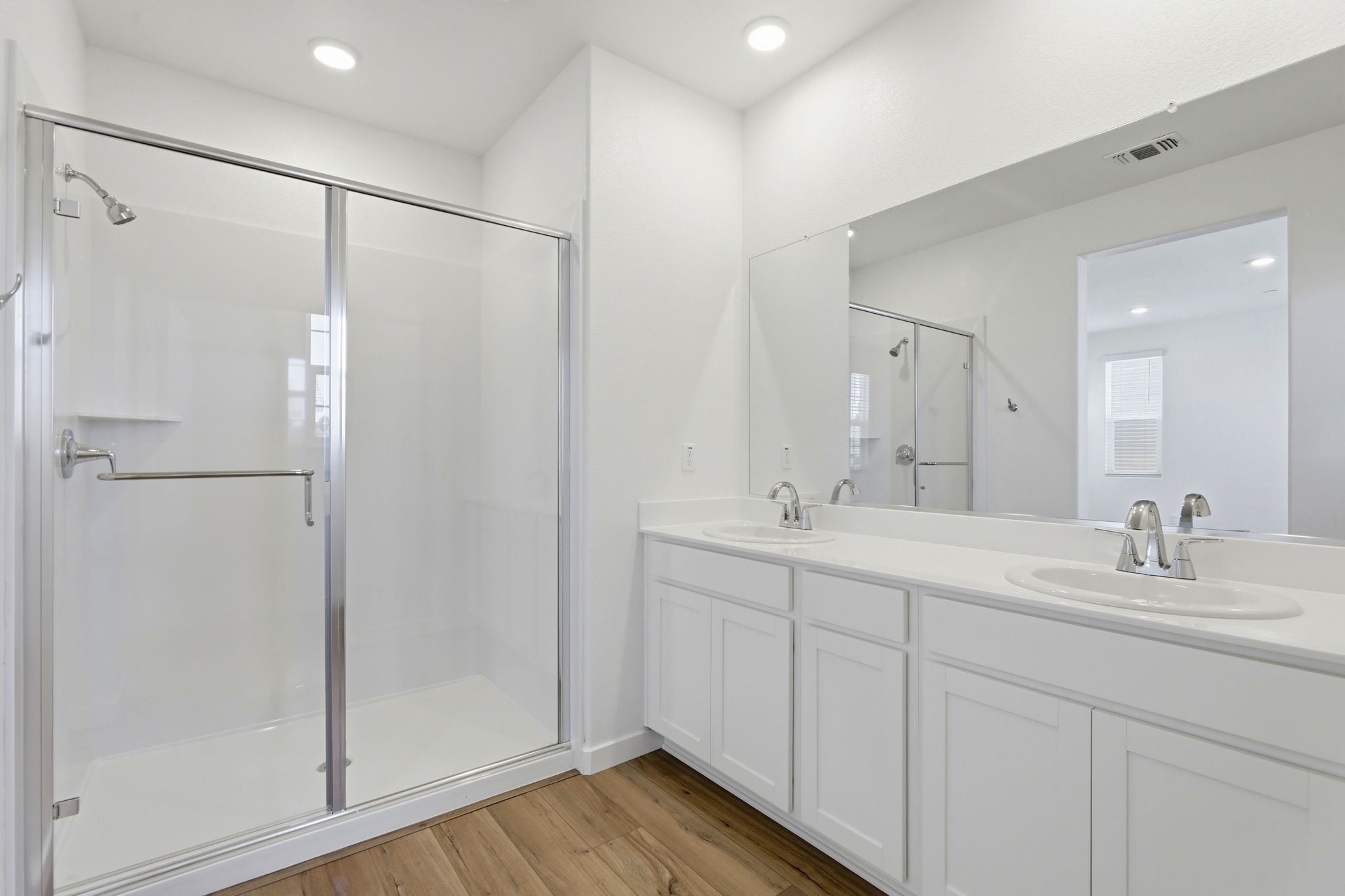 A bathroom with a glass shower.