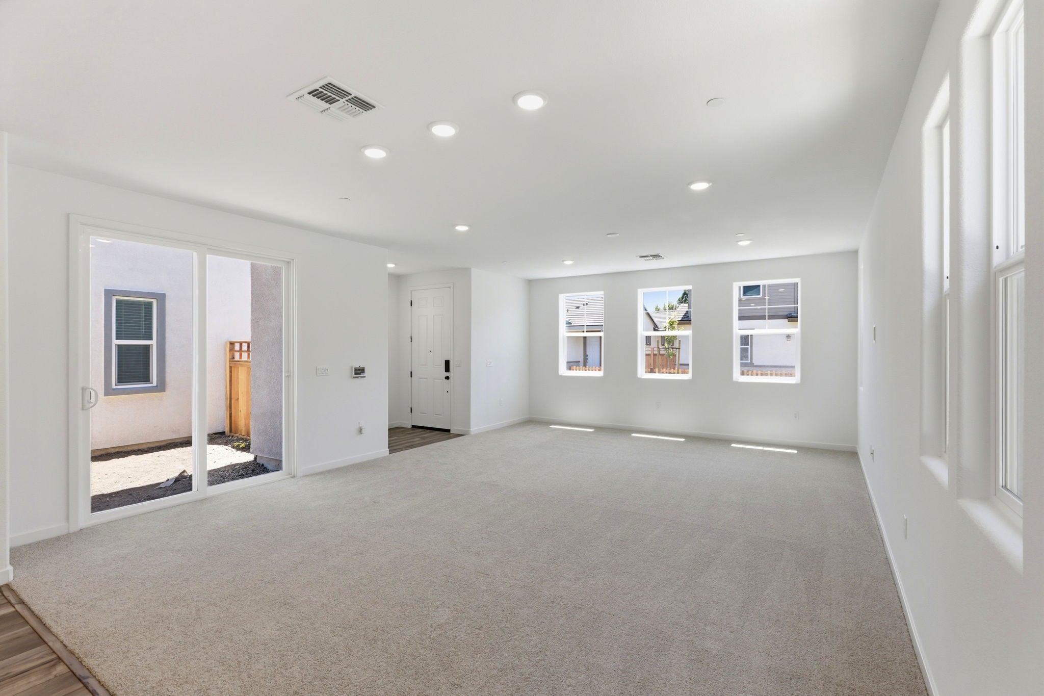 A long hallway with white walls.