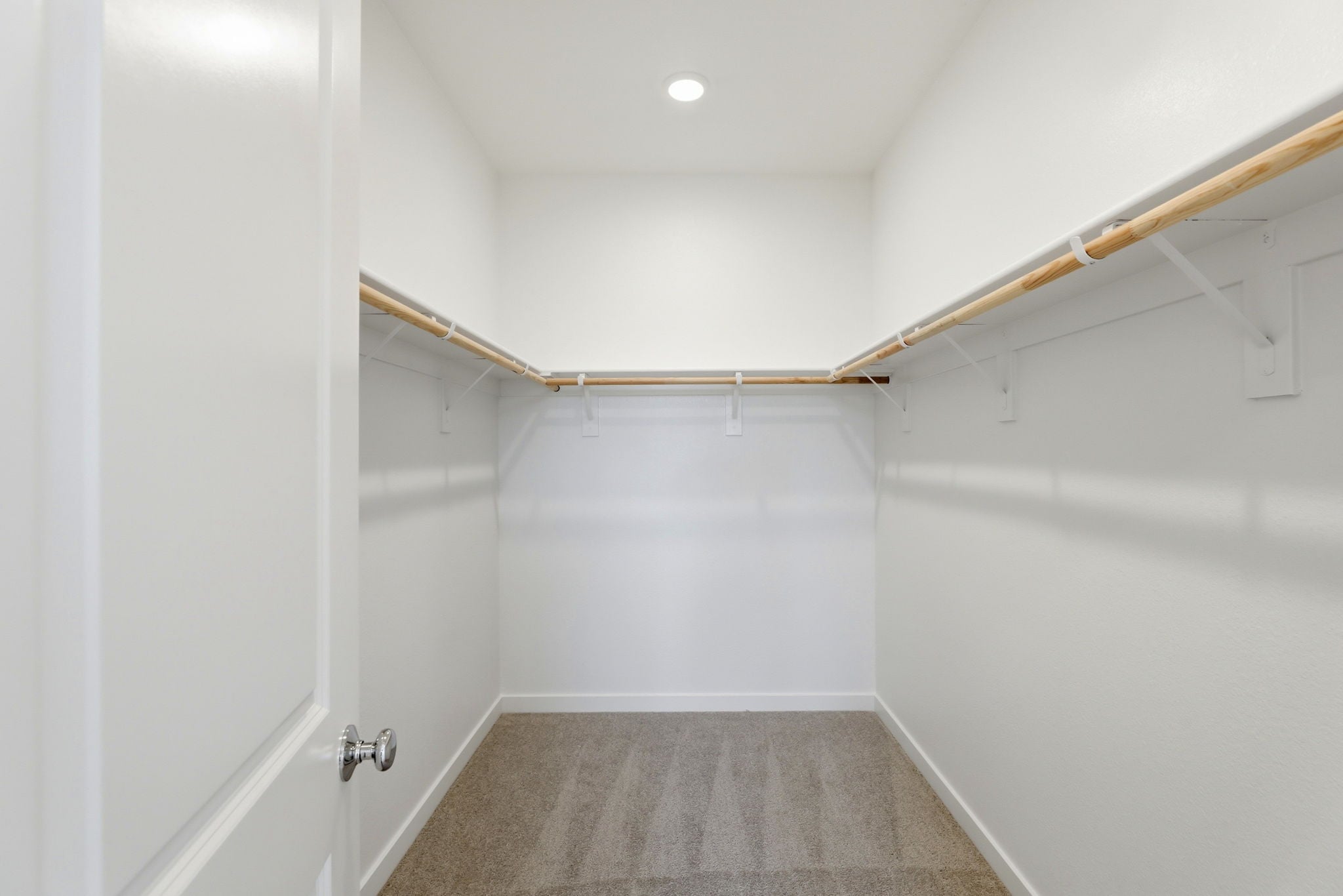 A hallway with white walls.