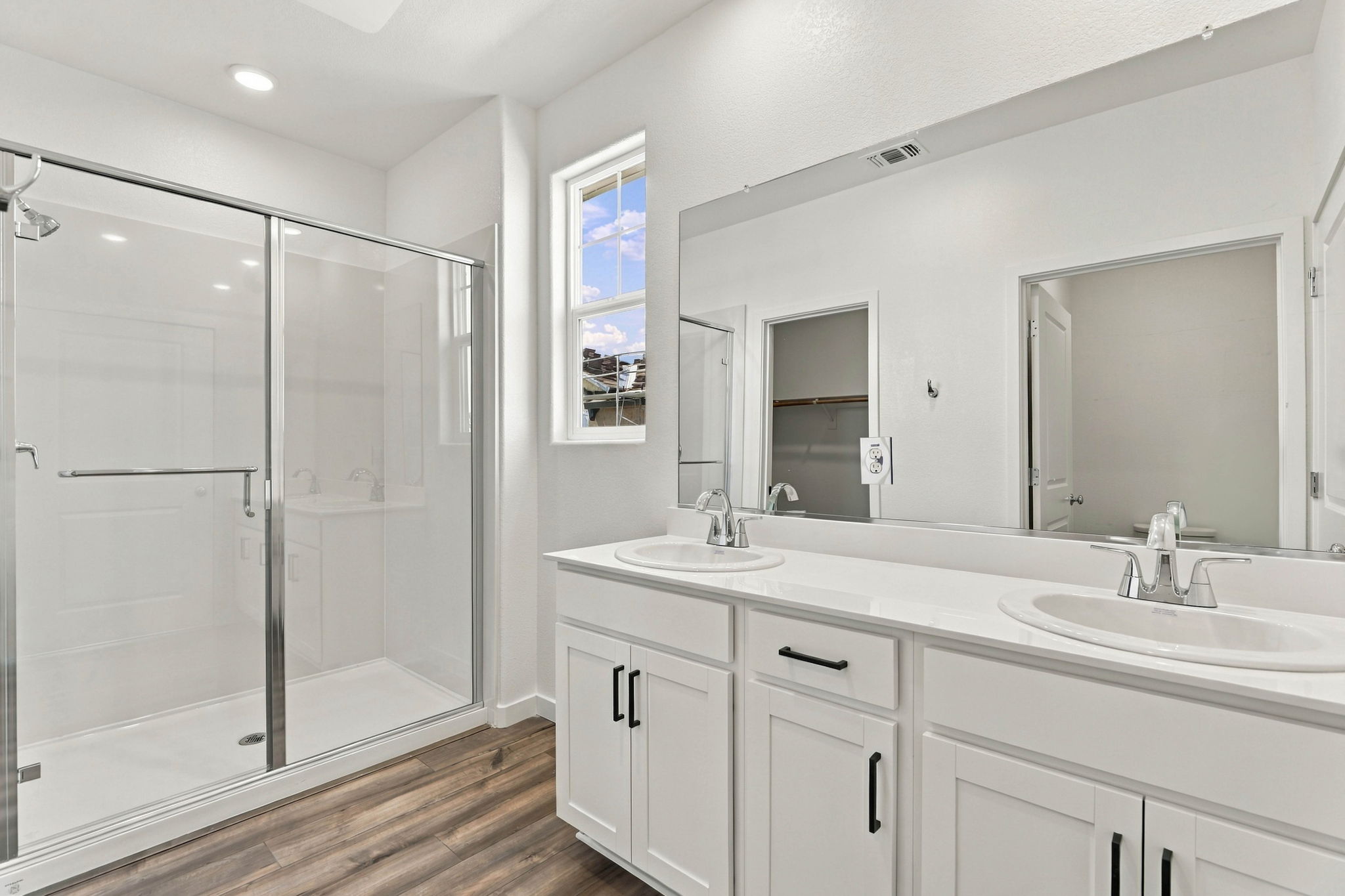 A bathroom with a glass shower.